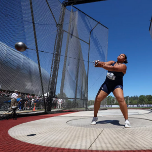 Amelia DiPaola swings a hammer during a track and field competition.