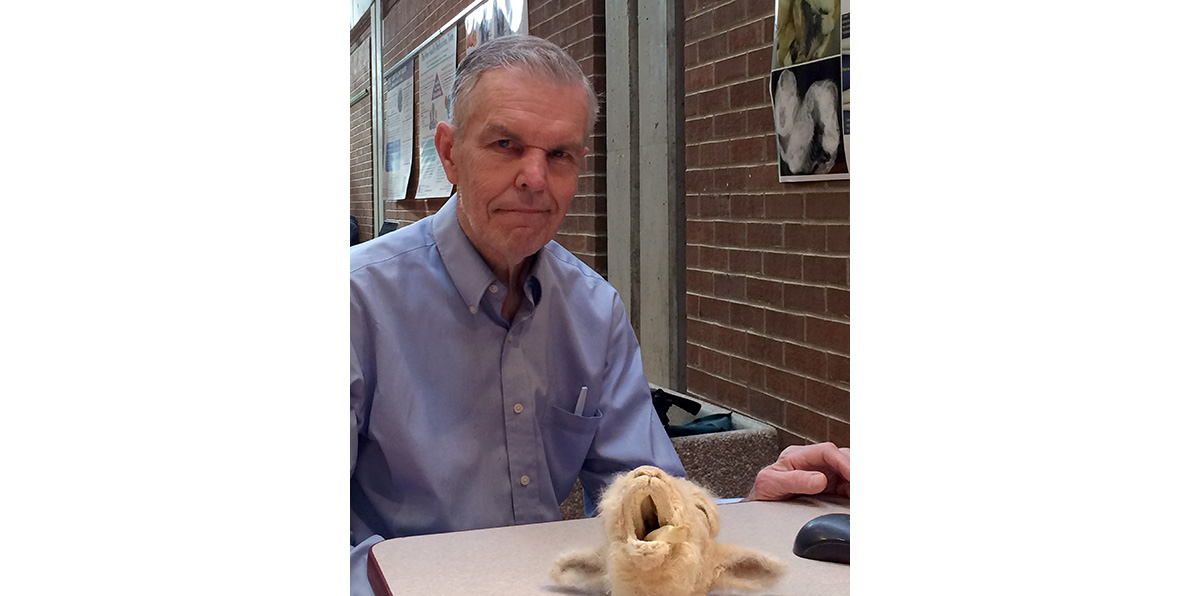 Vic Cox poses with anatomy specimens at the 2016 CVM Education Day