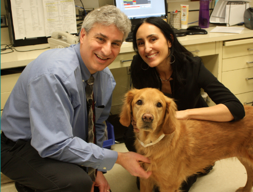 Drs. Jaime Modiano and Antonella Borgatti pose with canine patient, Valky.