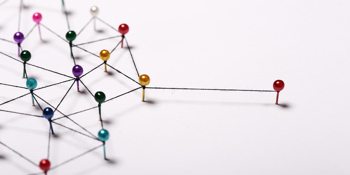 Pins wound together by string, representing contact networks