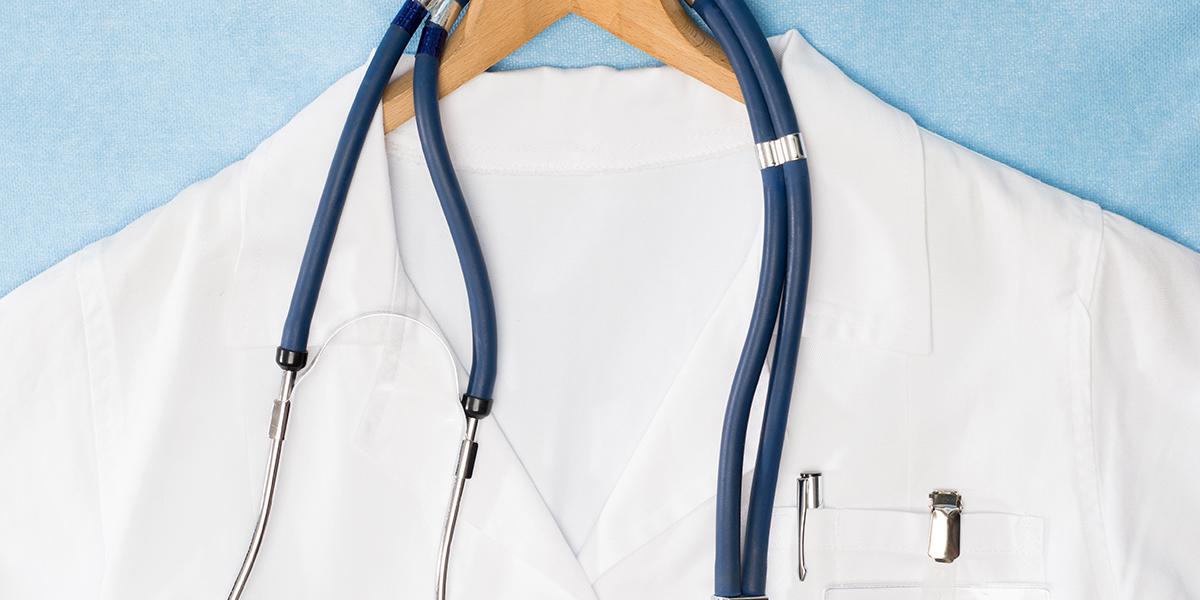 White medical coat on a hanger