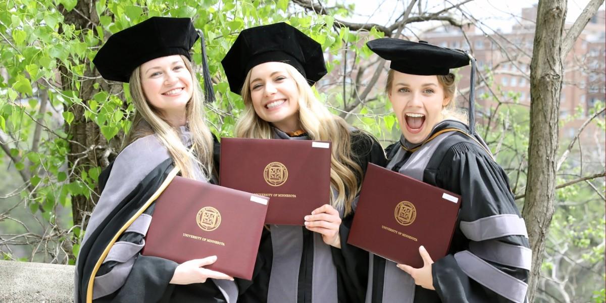 Three CVM graduates pose for a photo