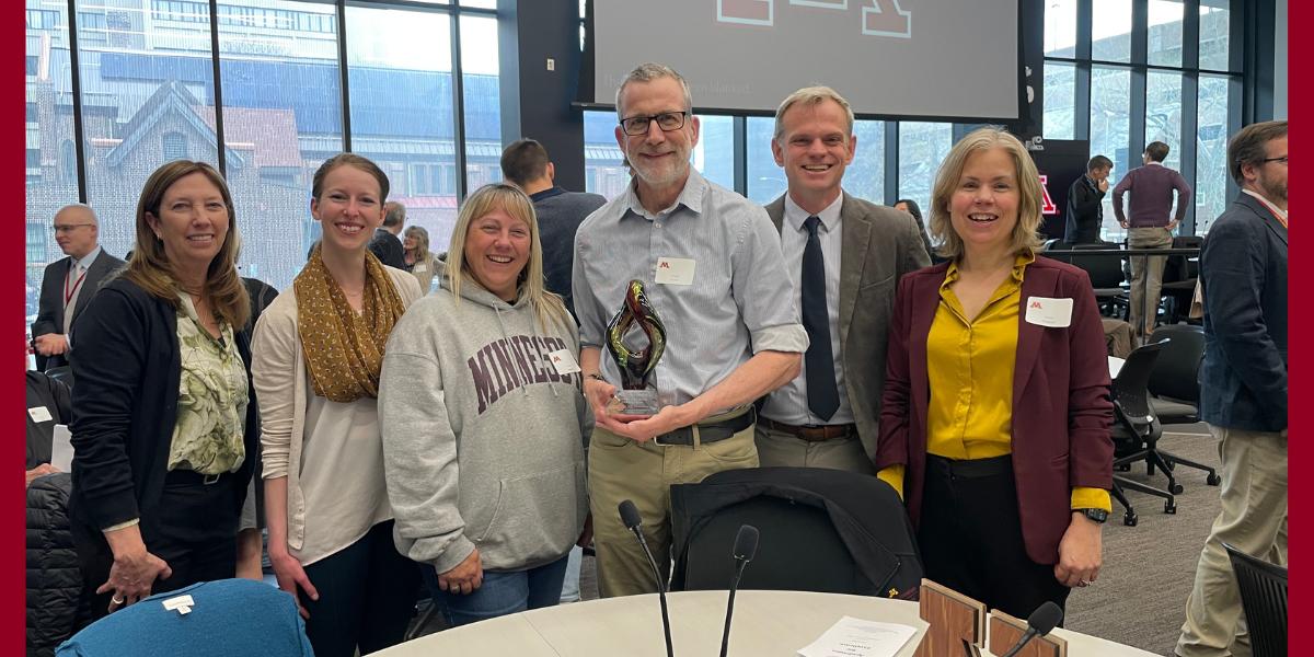 Dr. Amy Snyder, Dr. Susan Arnold, veterinary technician Anna Engrem, Dr. Alistair McVey, Dr. Chris Stauthammer, and CVM Dean Dr. Laura Molgaard attend a ceremony to celebrate McVey's induction into the UMN Academies for Excellence. 