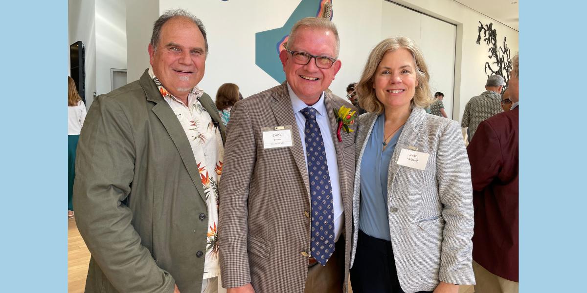 Department of Veterinary and Biomedical Sciences Chair Kent Reed (left), President's Award for Outstanding Service winner David Brown (center), and CVM Dean Dr. Laura Molgaard attend the award ceremony for presidential service award winners. 