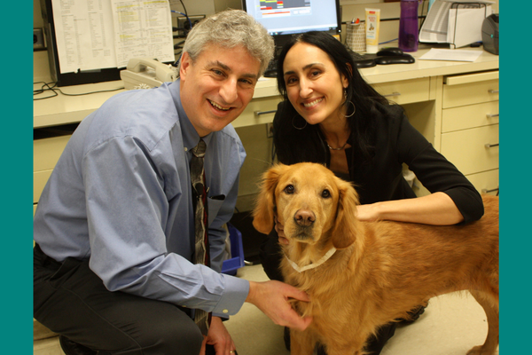 Drs. Jaime Modiano and Antonella Borgatti pose with canine patient, Valky.