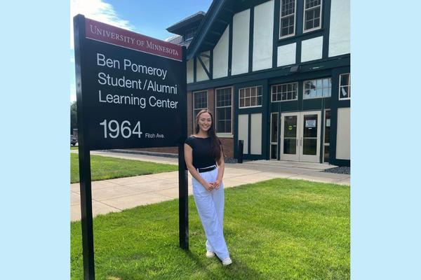 Courtney Labé stands outside the Ben Pomeroy Student-Alumni Learning Center. 