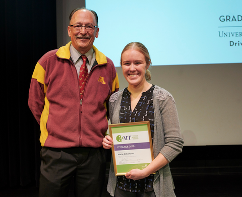 Marie Gilbertson with Vice Provost Scott Lanyon for Science in Seconds Competition
