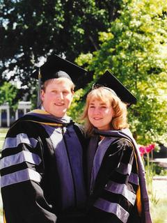 Jim (left) and Debbie (right) smile together at the camera on graduation day at the CVM in 1996