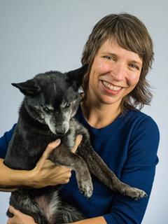 Kristi Flynn and her small, black dog named Tula