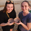 DVM students Tess Schaefer (left) and Madison Baumgartner hold newly hatched baby sea turtles.