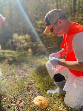 Dr. Jason Bartz, of Creighton University, retrieves a soil sample